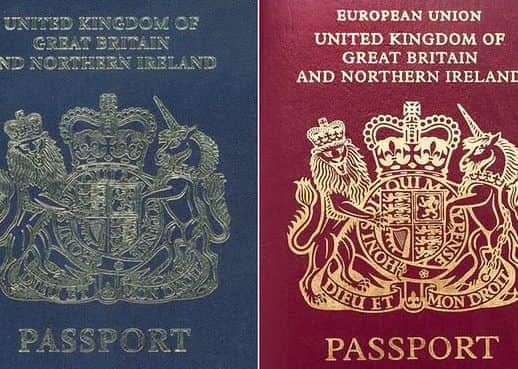 The original British blue passport, left, and the current burgundy one, right.