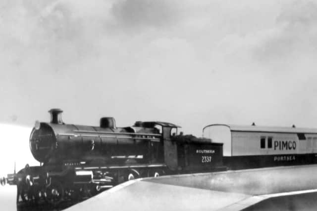 A manipulated photo, possibly taken at the low level platform of the Town station, Portsmouth, of the exhibition train laid on for the Portsea Island Co-Op. Picture: Barry Cox Collection.