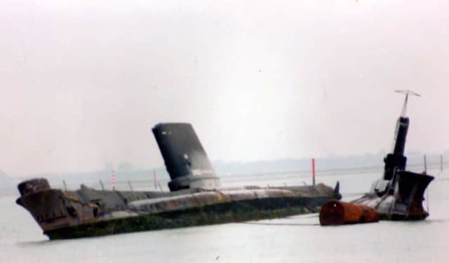 Abandoned and awaiting their fate, here we see the former HM Submarines Tiptoe, left,  and Artemis in Pounds yard, Portsmouth.  Picture: Roger Allen Collection