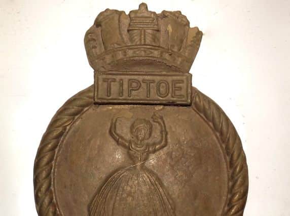 HMS Tiptoes solid bronze crest with a ballerina cast into it.