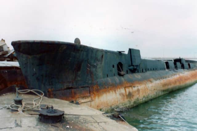 Former HM Submarine P556 abandoned in Harry Pounds yard. (Roger Allen)