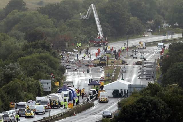 Emergency services working at the site of the Shoreham air disaster. Picture: Steve Parsons/PA Wire