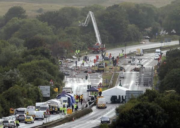 Emergency services working at the site of the Shoreham air disaster. Picture: Steve Parsons/PA Wire