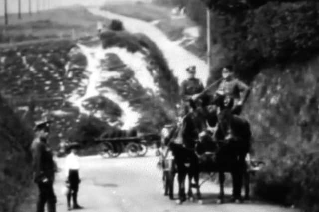 A little fuzzy perhaps but here we see Portsdown Hill Road where it meets London Road. The George pub would be on the right behind the soldiers. Picture: Barry Cox Collection