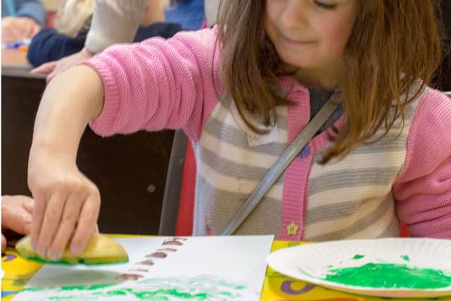 Grace Pettet, six, at Messy Church in All Saints Church, Denmead