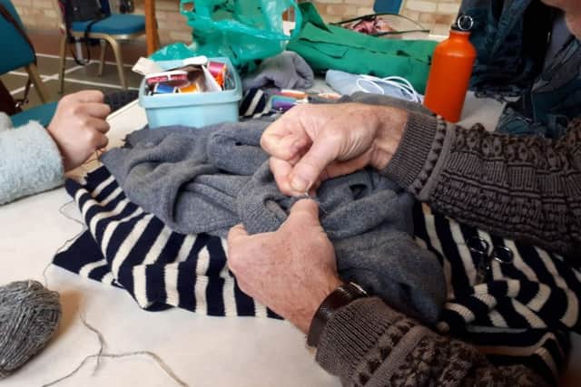 A jumper being fixed up at the cafe's recent trial. Credit: Repair Cafe Portsmouth