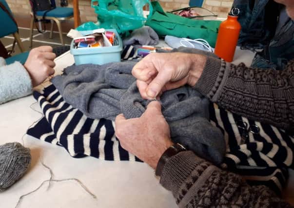 A jumper being fixed up at the cafe's recent trial. Credit: Repair Cafe Portsmouth