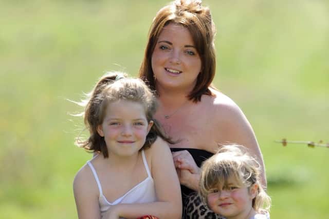 Mia Casey at home with her sister Poppy, three, and mum Jess      Picture:  Malcolm Wells (180420-1619)