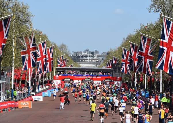 Runners make their way along The Mall towards finish line during the 2018 Virgin Money London Marathon