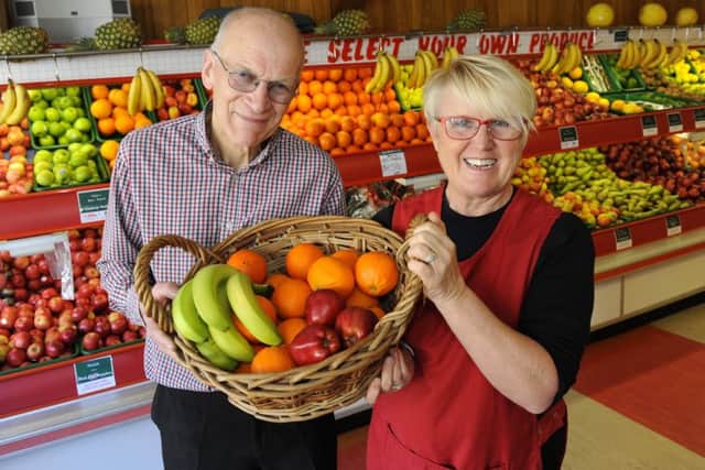 Peter Patterson with one of his shop assistants, Sandy Ayriss Picture by Malcolm Wells (180419-5188)