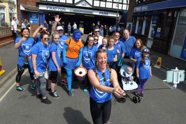 Blue Day fundraisers on a previous sponsored walk from Fratton Park to Gunwharf Quays, with Jade Armstrong taking a group selfie
