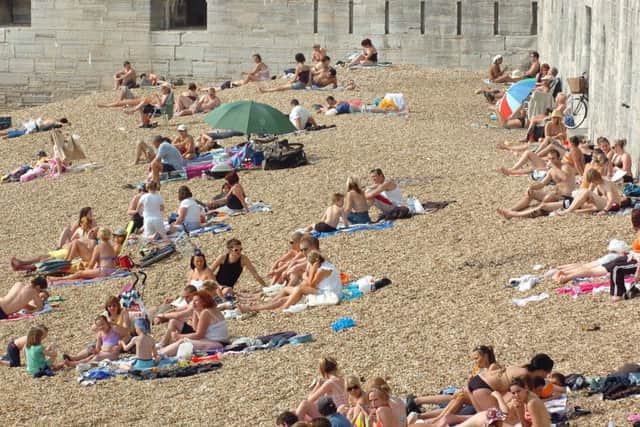 Innocent fun for these sunseekers, but residents have complained that others are causing trouble at Hot Walls in Old Portsmouth