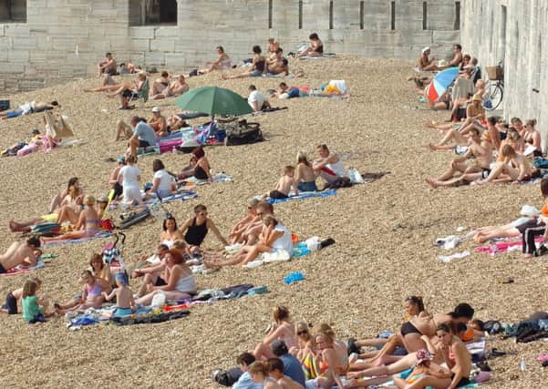 Innocent fun for these sunseekers, but residents have complained that others are causing trouble at Hot Walls in Old Portsmouth