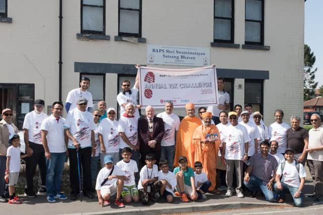 The Men from the Havant Hindu Temple gather outside with Deputy Mayor, Cllr Peter Wade prior to starting the sponsored walk
Picture: Keith Woodland