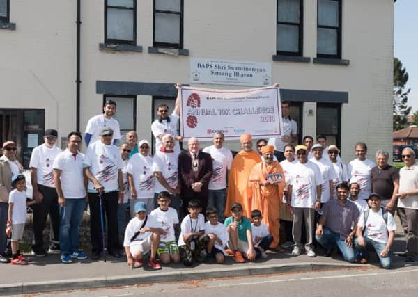 The Men from the Havant Hindu Temple gather outside with Deputy Mayor, Cllr Peter Wade prior to starting the sponsored walk     

Picture: Keith Woodland
