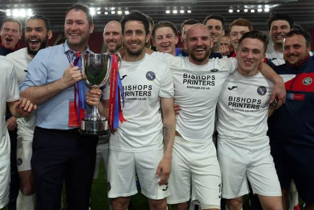 Lee Bradbury joins his Hawks team to celebrate his side's Hampshire Senior Cup victory at St Mary's Picture: Chris Moorhouse