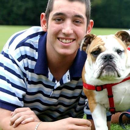 Tom Prince with Bubba, the bulldog bought for him by former Pompey manager Harry Redknapp