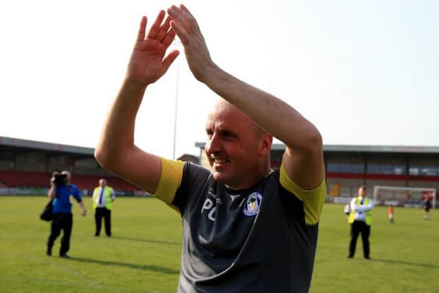 Wigan boss Paul Cook celebrates promotion. Picture: PA