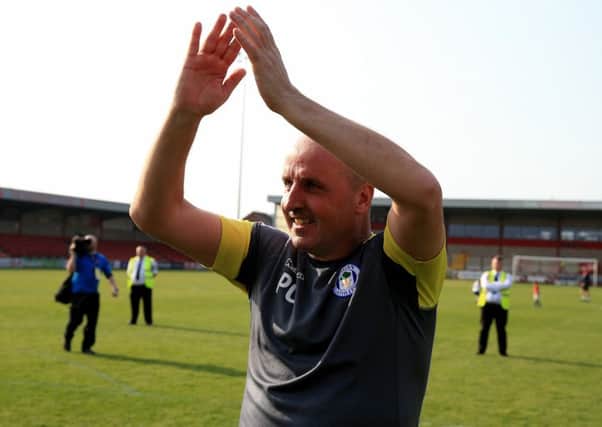 Wigan boss Paul Cook celebrates promotion. Picture: PA