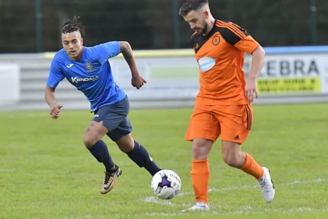 Joel Jackson, left, scored the fourth goal for Baffins