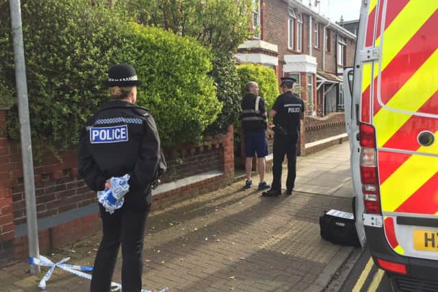 Officers outside a propety in Meon Road, Southsea