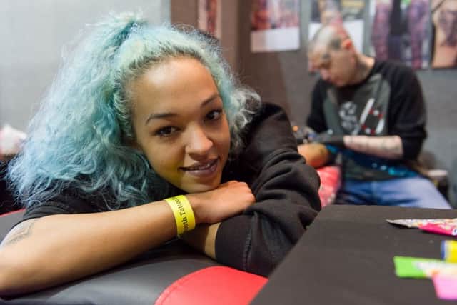 Sophie Richardson from Hayling Island is worked on by Mike Bays of the island's Studio 6 Picture: Duncan Shepherd (180343-007)