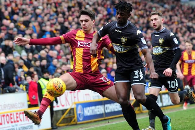 Bradford player Alex Gilleard, left, is challenged by Greg Leigh. Picture by Simon Hulme