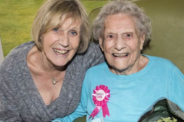 Babs Grove celebrating her 100th birthday with daughter Vivien. Picture: Murray Saunders