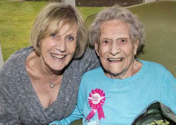 Babs Grove celebrating her 100th birthday with daughter Vivien. Picture: Murray Saunders