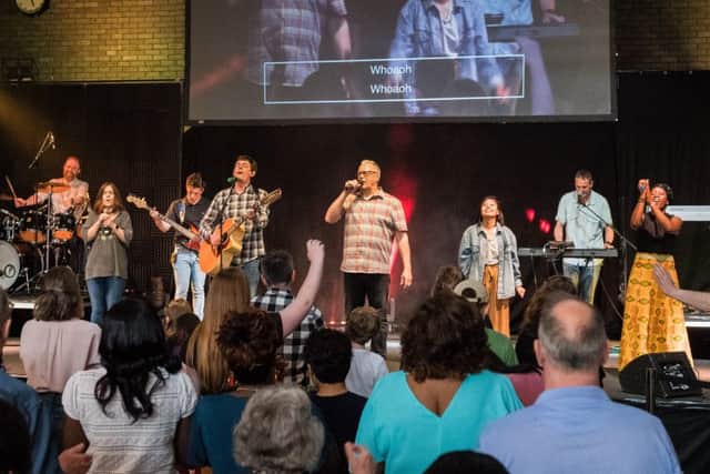 Andy Elmes on stage with the church band.Picture Credit: Keith Woodland