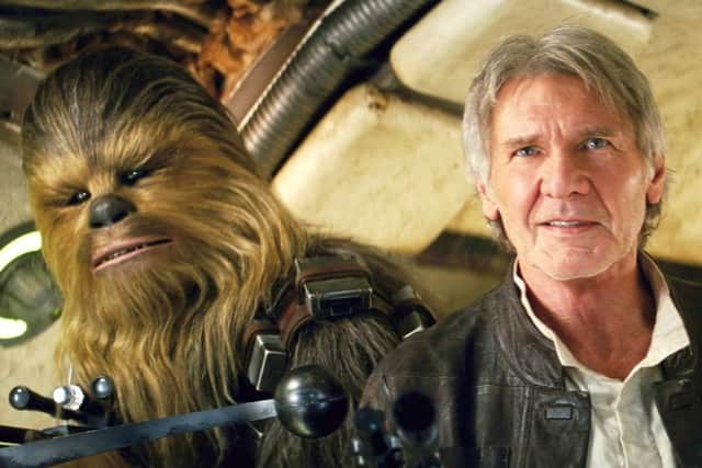 Chewbacca, left, and Harrison Ford as Han Solo in Star Wars: The Force Awakens