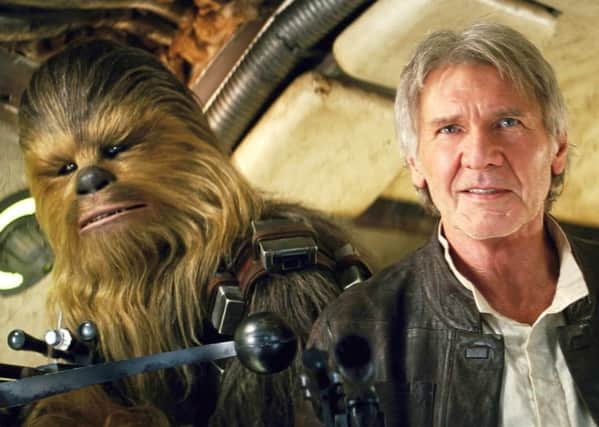 Chewbacca, left, and Harrison Ford as Han Solo in Star Wars: The Force Awakens
