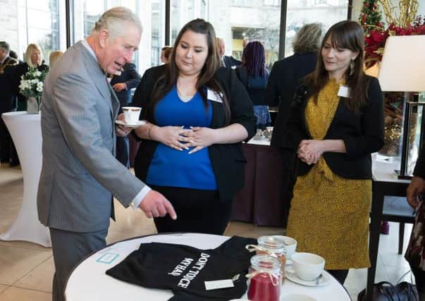 Carly Thompsett  discusses her products with Prince Charles