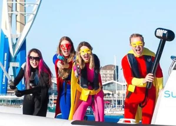 From right, Captain Comic Con, Southsea Superwoman, a sidekick and the Solent Assassin. Credit: Portsmouth Guildhall