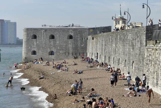 Sunbathers on Hot Walls enjoying the sunshine. Picture: Neil Marshall
