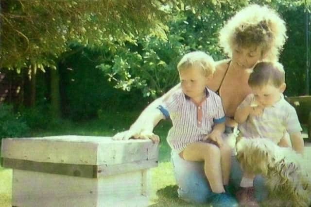 jpns 260518 retro may 2018Bees - Anne Boyd with Adam and Nathan and the hive that houses the swarm