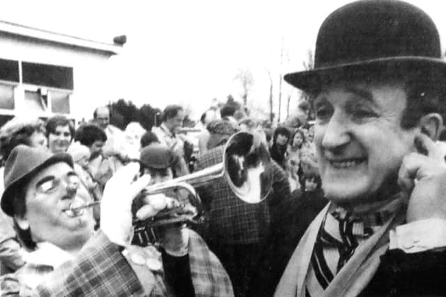 The president of Clowns International, actor Ron Moody, gets a blast from Perzon, alias Dave McIntyre, of Glasgow