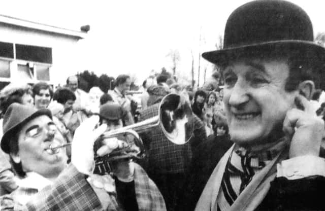 The president of Clowns International, actor Ron Moody, gets a blast from Perzon, alias Dave McIntyre, of Glasgow