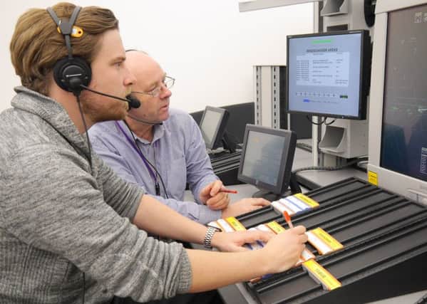 David Wright and his trainer at Nats air traffic control training facility