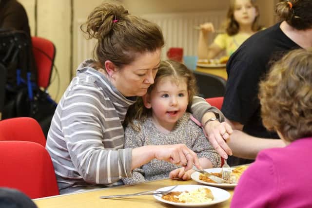 Bethan Walker and her mum Charlotte enjoying hot food at Leesland Neighbourhood Church