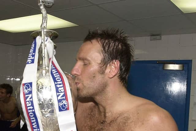 Paul Merson with the Division One title
