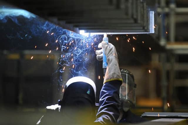 A welder at work during construction of the new aircraft carrier HMS Queen Elizabeth