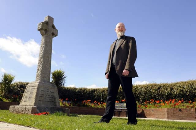 The Rev Dr Paul Chamberlain, the Vicar of St Faith's Church in Lee-on-the-Solent with the town's war memorial. 


Picture: Malcolm Wells (180426-6030)