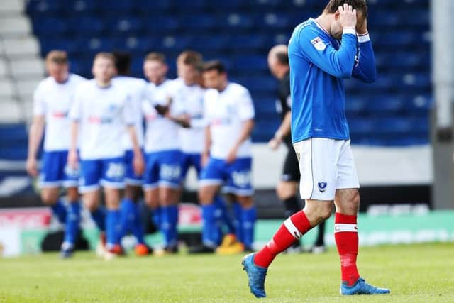 Brett Pitman holds his head in his hands as the Bury players celebrate Picture: Joe Pepler