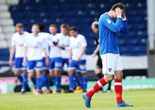 Brett Pitman holds his head in his hands as the Bury players celebrate Picture: Joe Pepler
