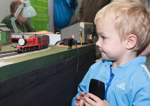 Tristan Davies, 4 gets to play with one of Thomas the Tank engine's friends
Picture by Keith Woodland