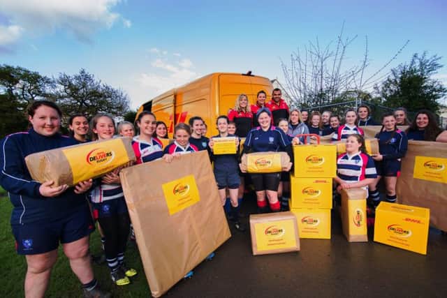 Vickii Cornborough, along with her Harlequins club-mates Abbie Scott and Joe Marchant, delivers kit to her former club Havant