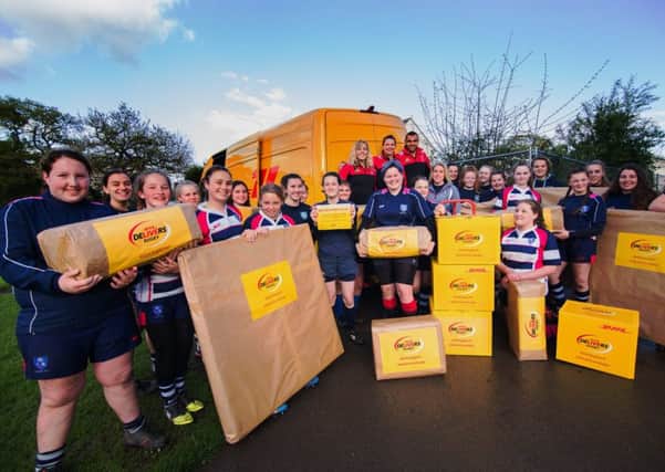Vickii Cornborough, along with her Harlequins club-mates Abbie Scott and Joe Marchant, delivers kit to her former club Havant