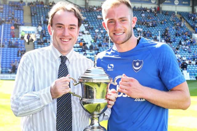 Matt Clarke is presented with The News/Sports Mail Pompey Player of the Year Trophy by chief sports writer Neil Allen Picture: Joe Pepler