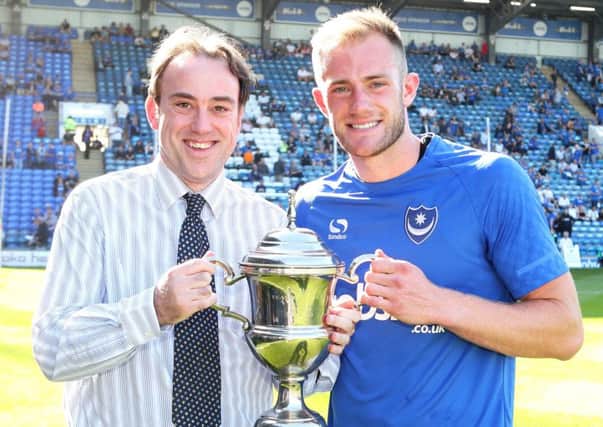 Matt Clarke is presented with The News/Sports Mail Pompey Player of the Year Trophy by chief sports writer Neil Allen Picture: Joe Pepler